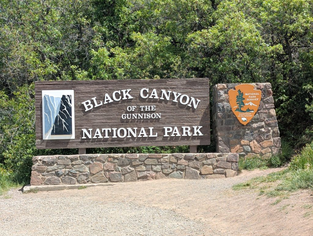 The official entrance sign for Black Canyon of the Gunnison National Park in Colorado.