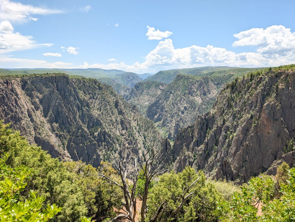 Panoramic view of the dark, steep canyon walls from Tomichi Point at Black Canyon of the Gunnison National Park CO.
